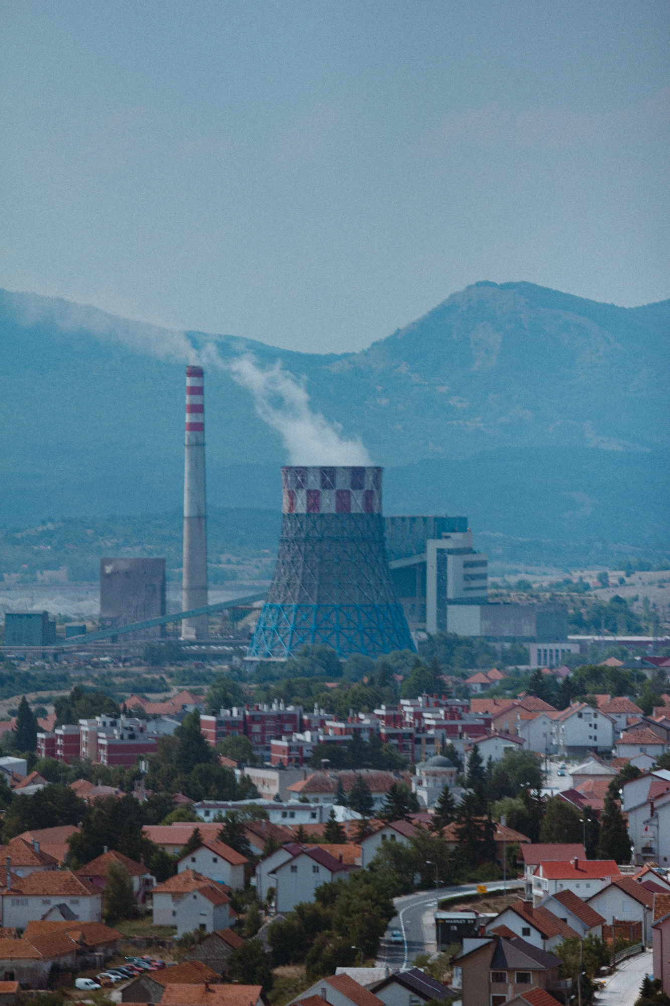 A large cooling tower in the middle of the city