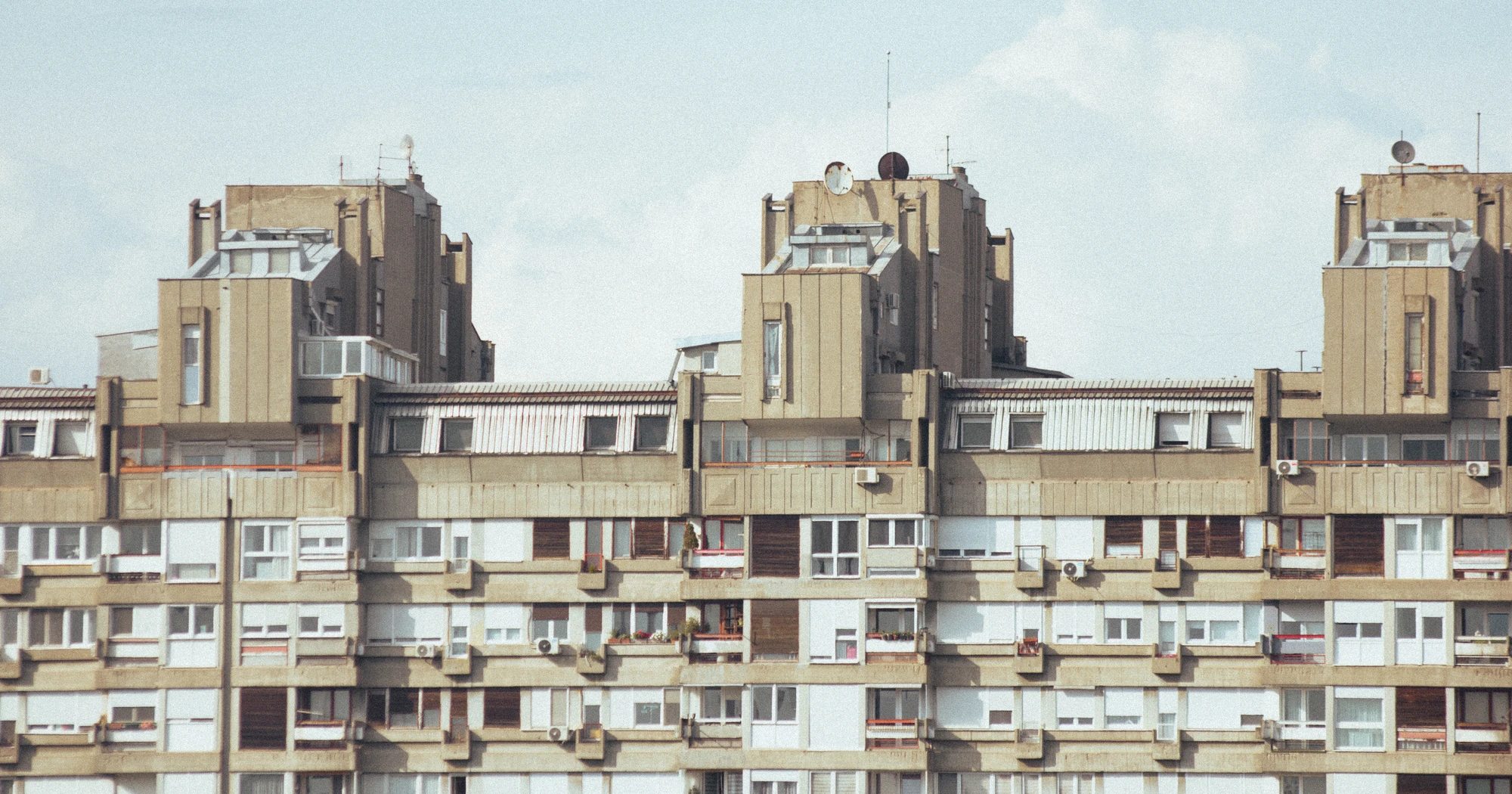 Many windows on the side of a building