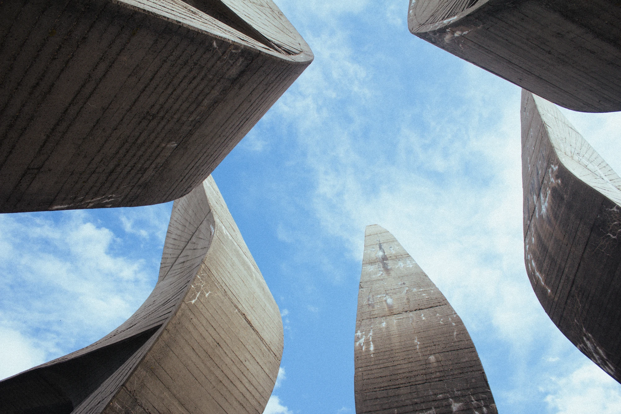 A large concrete memorial with a sky background