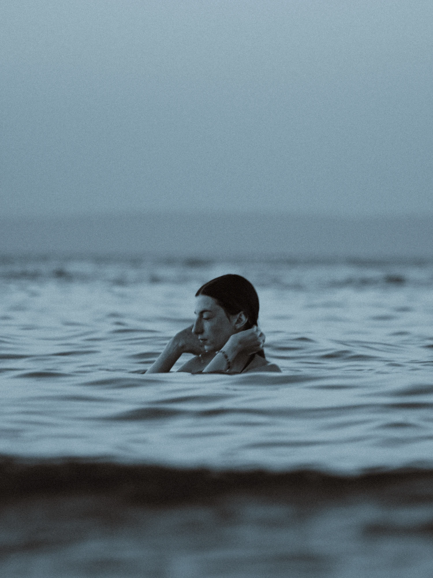 Woman floating in the calm sea
