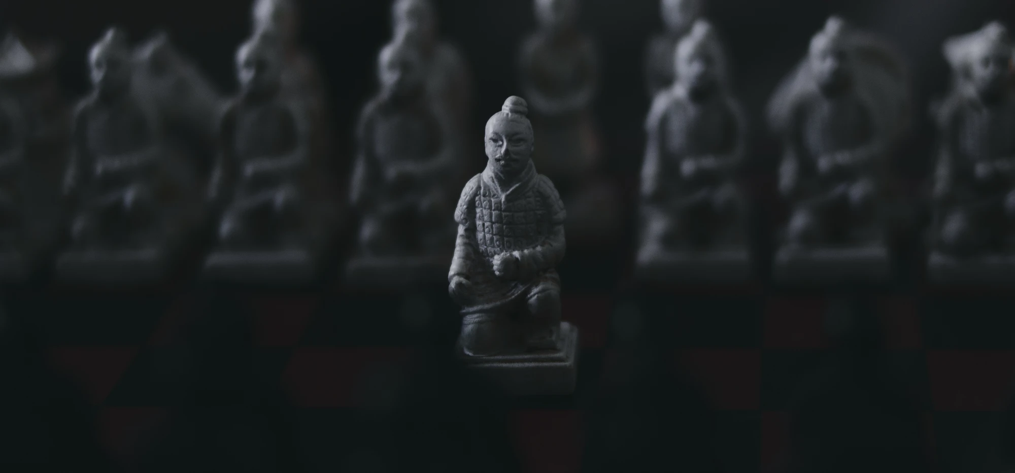1.d4, a white pawn on a samurai-themed chess board set
