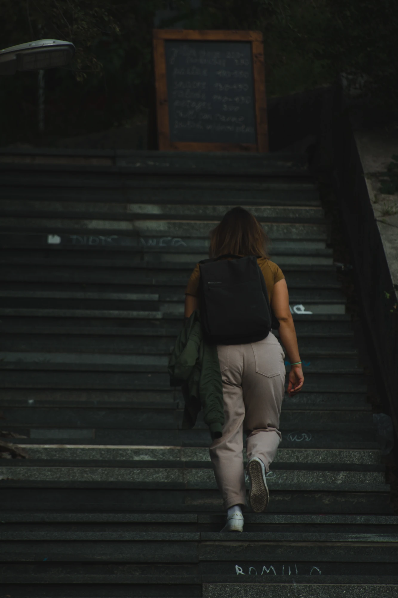 A girl walking up the stairs