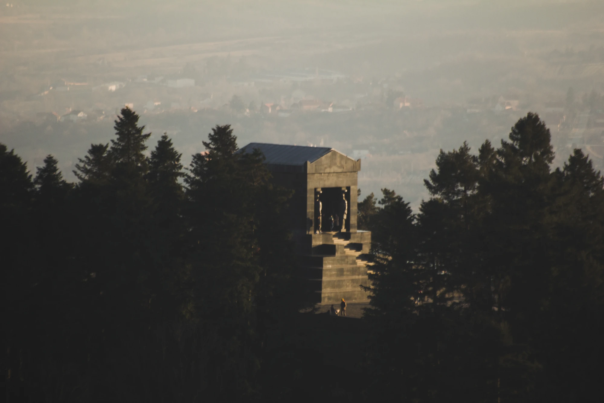 A war memorial in the middle of a forest