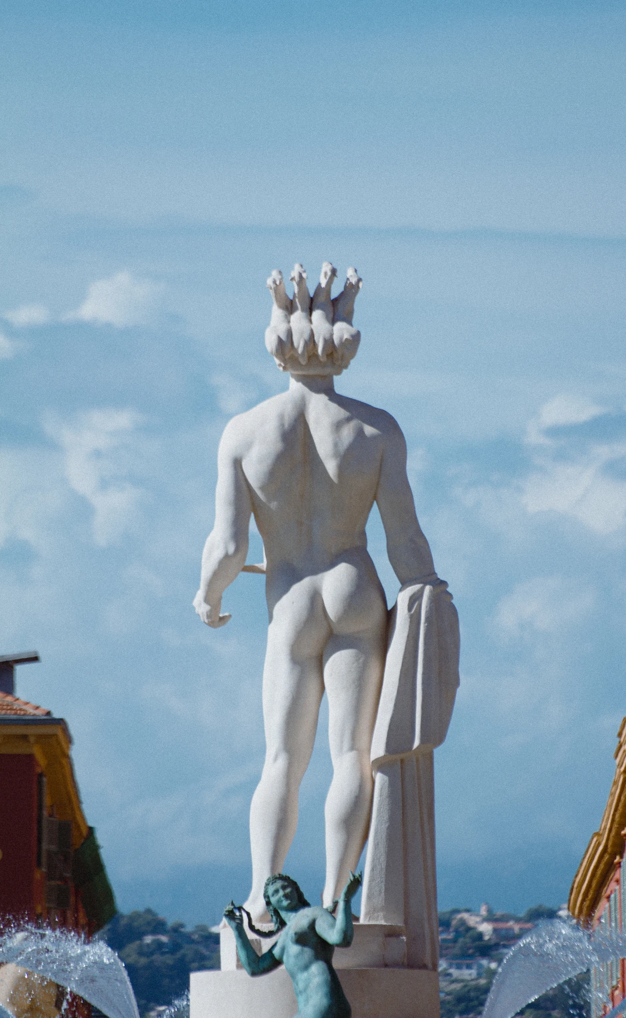 A statue of a man with a crown on his head